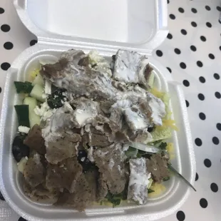Extra meat from pita on rice with veggies. Love the tabouli, cucumber, black olives, onions, jalapeños, and feta cheese.