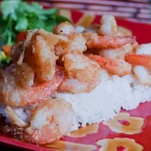 World Famous Garlic Shrimp with fresh steamed rice, organic salad, and potato/Mac salad.