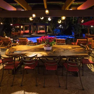 Our grand family table sits 12-15. It&apos;s made from a single slab of monkeypod. Planted in the 1890 by missionaries on King Kamehameha V home.