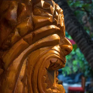 The Hawaiian god KU is hungry and angry (hangry) as he greets customers with his mouth open and reflecting the hunger in arriving guests!
