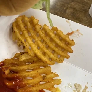 a plate of fries and ketchup