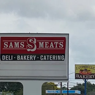 a sign for sam's meats deli bakery catering