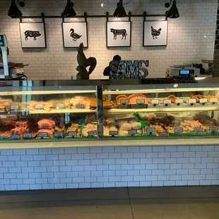 a display of meat and pastries