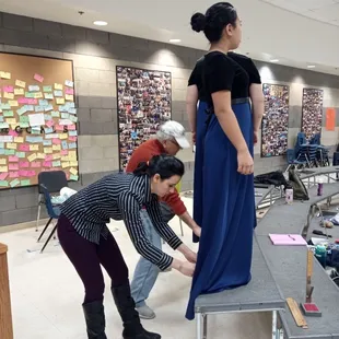 Father daughter duo hemming dresses