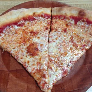 Two slices of pizza right out the oven!