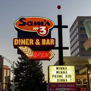 a sign for sam&apos;s diner and bar