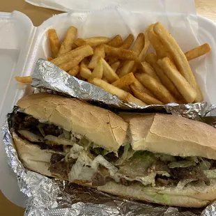 Philly cheesesteak sub and fries
