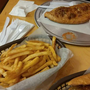 Regular fries that came with sub. Big portion, also decent. Calzone in back which was good.