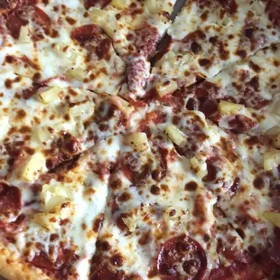 Pepperoni and pineapple pizza