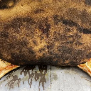 Burnt pizza.