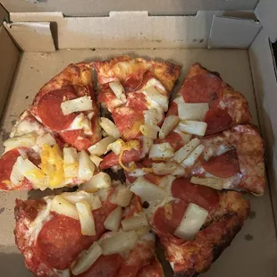 Small pepperoni and pineapple pizza