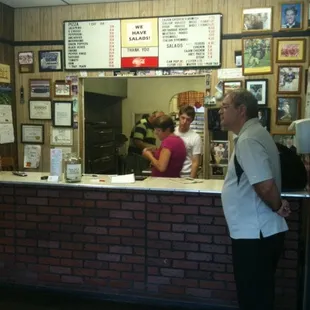 a man standing in front of the counter