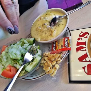 a plate of food with a salad and a drink