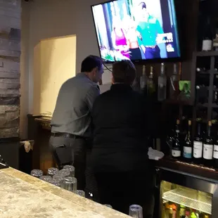 a man and a woman watching tv