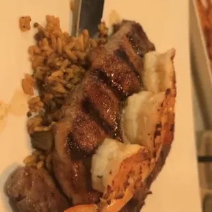 Rib Ribeye Choice Angus with shrimp and dirty rice.