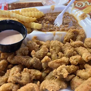 Crawfish bites, fries, and baked beans.