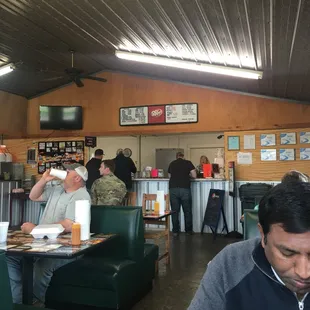 a man sitting at a table in a restaurant