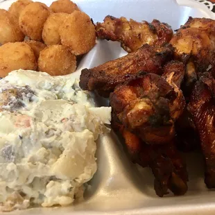 Smoked wing plate with cheese tots and potato salad