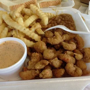Crawfish tails with frenchfries, baked beans and dipping sauce.