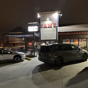 cars parked in front of the restaurant