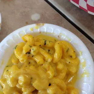 The food was not edible . The fish was rubbery and overcooked. The mac and cheese was soupy and bland.