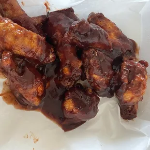 chicken wings and rice in a styrofoam container