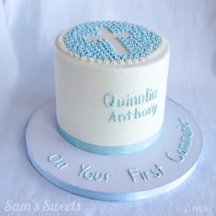 a blue and white first birthday cake