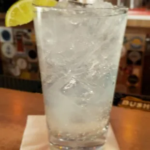 a glass of water on a napkin