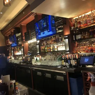 a bar with a lot of bottles