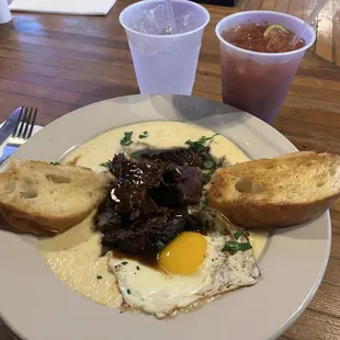 OMG Beer Braised Beef Short Ribs over cheesy grits with a sunny egg with buttery toast!!! And a Bloody Mary!!!!