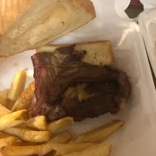 a steak sandwich and french fries
