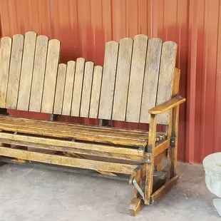 A comfy glider on the porch.