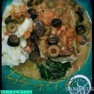 Wild Mahi over spinach with buttermilk garlic mashed potatoes in a Chardonnay lemon butter with black and green olives and diced tomatoes.