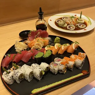 Sushi - tuna and salmon, sashimi - tuna and salmon, wasabi tobiko, veggie roll and Tokyo roll