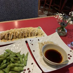 Bar area having some wine, edemame, gyoza &amp; the wow wow roll