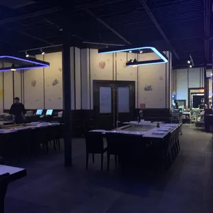 a dining room with tables and chairs