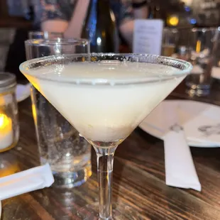 a martini in a glass on a table