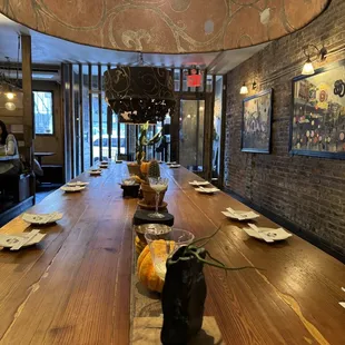 a long wooden table in a restaurant