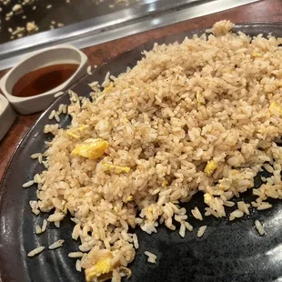 a plate of fried rice on a table
