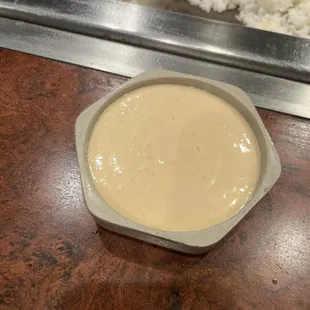 a bowl of sauce and rice