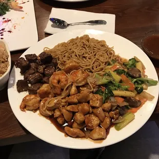 Habachi steak, shrimp, and chicken with noodles and vegetables