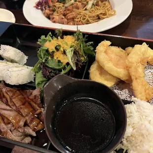 Beef and vegetables and shrimp tempura with cali roll.  Also chicken Yakisoba in the back.