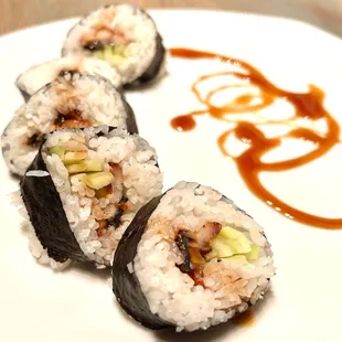 Eel roll ($9.50 - 5 pieces) with hardly any eel. I swirled the eel sauce around my plate &amp; made it look pretty. Rice is good. Eel, ???