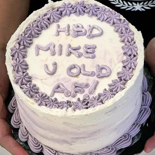 a cake with purple frosting