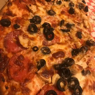 a pepperoni and olive pizza