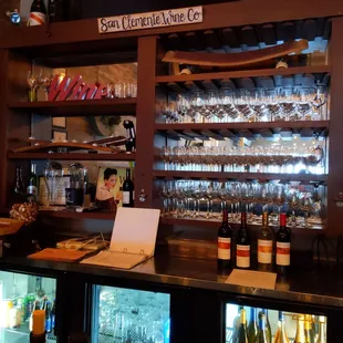 a bar with wine bottles