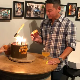 Axe Throwing birthday party Cake with a sugar Old Fashion drink on the side.