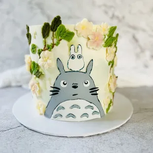 a cake decorated with a totoro