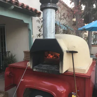 an outdoor pizza oven