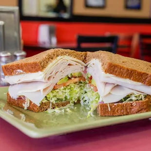 two halves of a sandwich on a plate